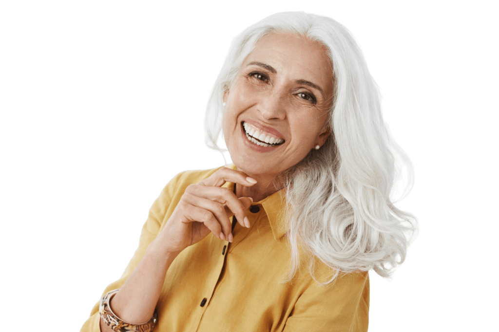 Smiling older woman next to information about dental implants at Page Family Dentistry in River Falls, WI, a long-term solution for replacing missing or broken teeth.